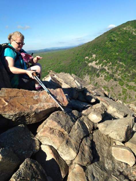 Crawling over the top...Not a pretty picture, but major concentration going on here.  Climb up, throw poles, climb to poles, throw them again...